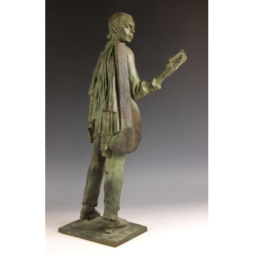 151 - John W Mills (1933-2023),  
Musician reading and holding books,  
Patinated resin on integral base, ... 