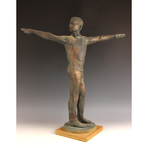 153 - John W Mills (1933-2023),  
Boy with arms outstretched,  
Patinated resin on wooden base,  
65cm hig... 