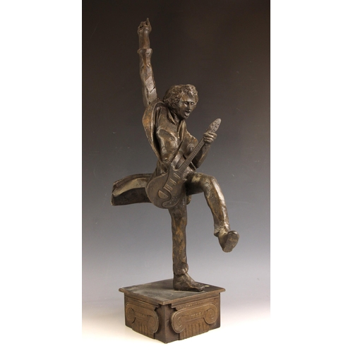 164 - John W. Mills (1933-2023),   
Brian May playing guitar (leg raised) #1,  
Patinated cold cast bronze... 