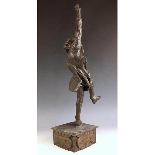 164 - John W. Mills (1933-2023),   
Brian May playing guitar (leg raised) #1,  
Patinated cold cast bronze... 