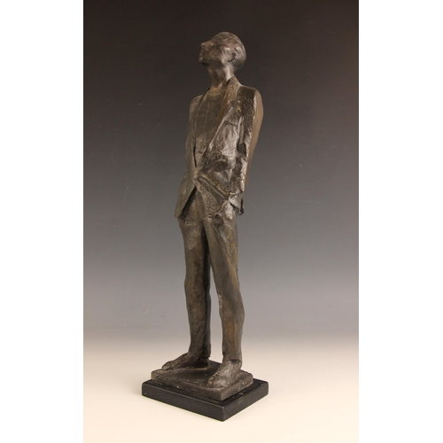 174 - John W Mills (1933-2023),  
Man with hands in pockets looking up,    
Patinated cold cast bronze on ... 