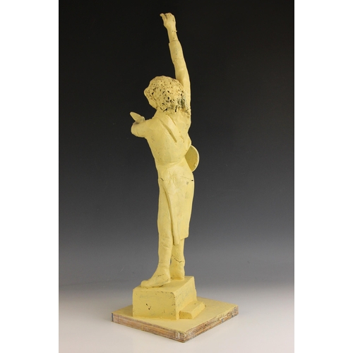 176 - John W. Mills (1933-2023),   
Brian May playing guitar (leg down),  
Painted resin on stepped base, ... 