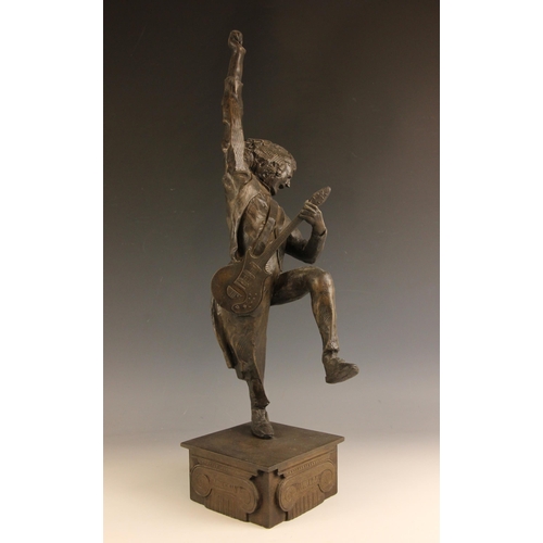 180 - John W. Mills (1933-2023),   
Brian May playing guitar (leg raised) #2,  
Patinated cold cast bronze... 