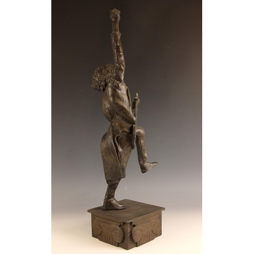 180 - John W. Mills (1933-2023),   
Brian May playing guitar (leg raised) #2,  
Patinated cold cast bronze... 