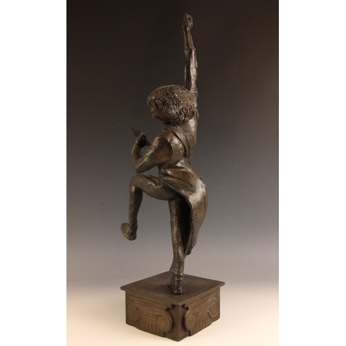 180 - John W. Mills (1933-2023),   
Brian May playing guitar (leg raised) #2,  
Patinated cold cast bronze... 