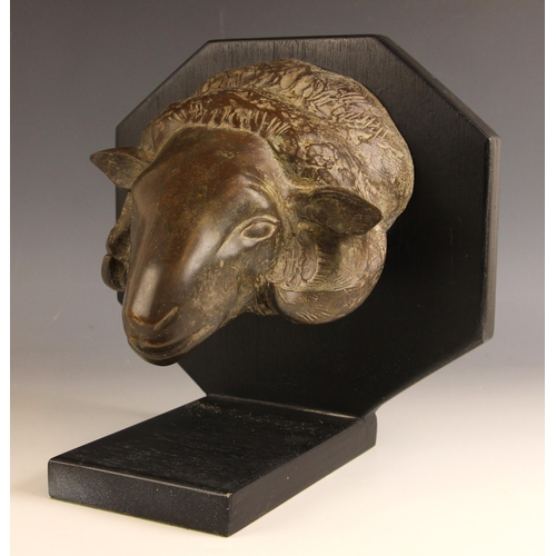 449 - John W Mills (1933-2023),   
Ram’s mask,   
Patinated bronze on octagonal shield base,   
27cm high ... 