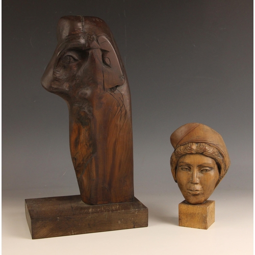 552 - Head, abstract form,  
Wood on wooden stand,  
38cm high,  
With a carved mask of a medieval lady, s... 