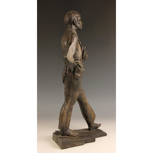 133 - John W Mills (1933-2023),  
Academic carrying books,  
Patinated cold cast bronze on integral base, ... 