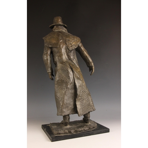 134 - John W Mills (1933-2023),  
Man in Sou'wester,  
Patinated cold cast bronze on ebonised base,  
62cm... 