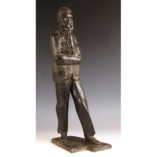 143 - John W Mills (1933-2023),  
Schoolboy carrying books,  
Patinated resin on integral base,  
50.5cm h... 