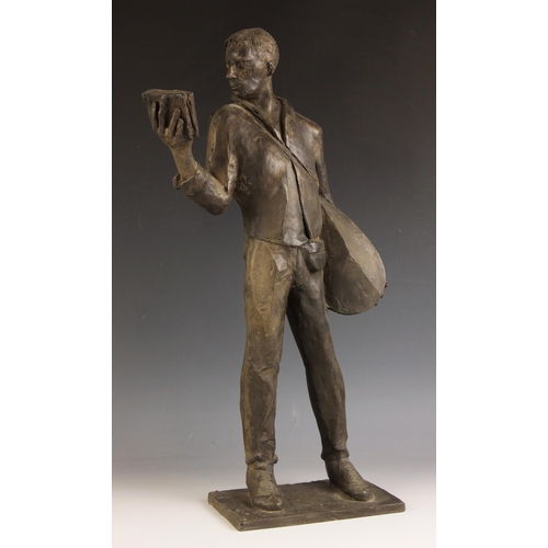 147 - John W Mills (1933-2023),  
Musician reading a book (right hand),  
Patinated resin on integral base... 