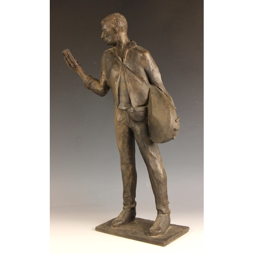 147 - John W Mills (1933-2023),  
Musician reading a book (right hand),  
Patinated resin on integral base... 