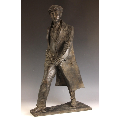 157 - John W Mills (1933-2023),  
William Mills,  
Man in flat cap striding,  
Black resin on integral bas... 