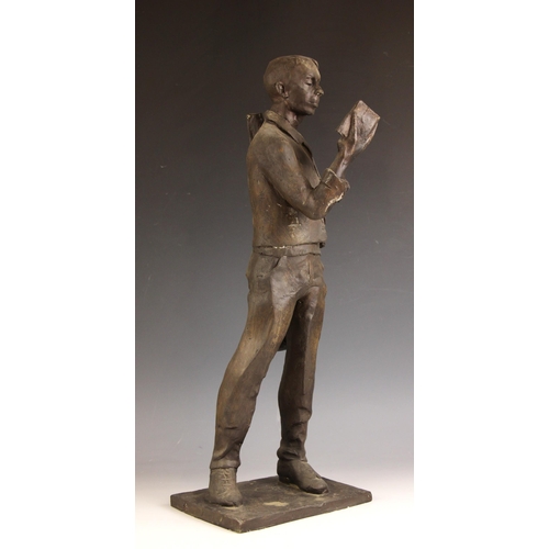 159 - John W Mills (1933-2023),  
Musician reading a book (right hand) #2,  
Patinated resin on integral b... 