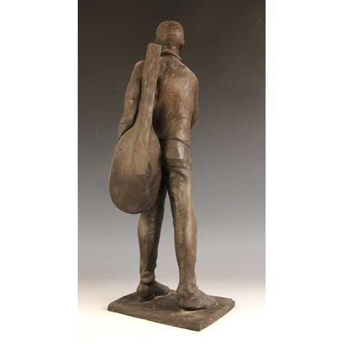 159 - John W Mills (1933-2023),  
Musician reading a book (right hand) #2,  
Patinated resin on integral b... 