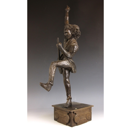 164 - John W. Mills (1933-2023),   
Brian May playing guitar (leg raised) #1,  
Patinated cold cast bronze... 