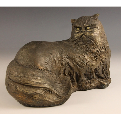 462 - John W Mills (1933-2023),   
Chloe,  
Recumbent cat, head turned,   
Patinated resin, freestanding, ... 