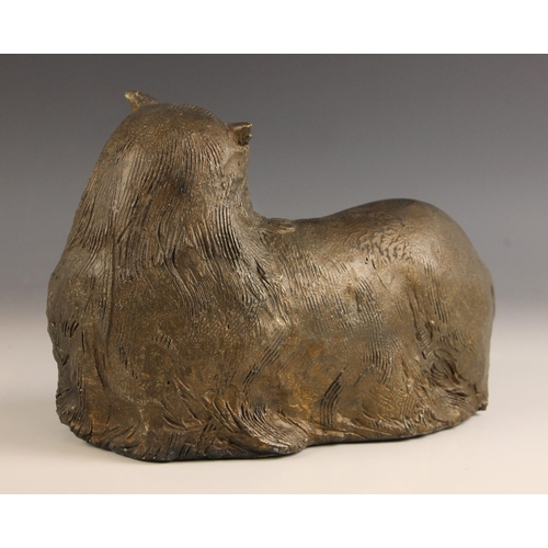 462 - John W Mills (1933-2023),   
Chloe,  
Recumbent cat, head turned,   
Patinated resin, freestanding, ... 