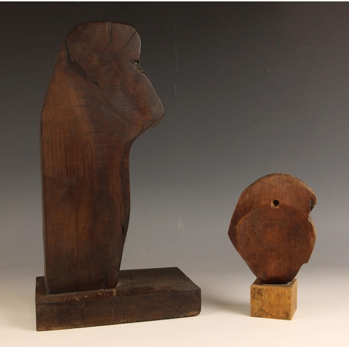 552 - Head, abstract form,  
Wood on wooden stand,  
38cm high,  
With a carved mask of a medieval lady, s... 