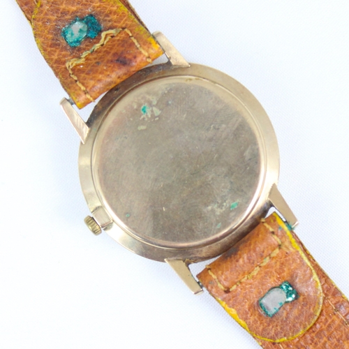 131 - A 9ct gold cased Rotary wristwatch, the circular silver coloured dial with shaped square shaped mark... 