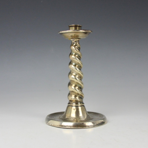 15 - A George V silver candlestick, A & J Zimmerman Ltd, Birmingham 1923, of Arts and Crafts barley twist... 