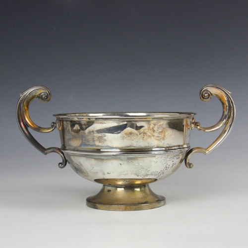 25 - An Edwardian silver twin handled bowl, The Alexander Clark Manufacturing Co, London 1906, the scroll... 