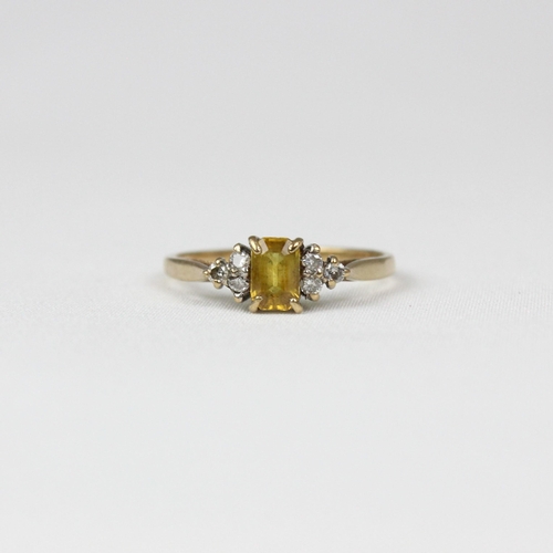 319 - An early 20th century style diamond and yellow sapphire ring, the emerald cut yellow sapphire with t... 