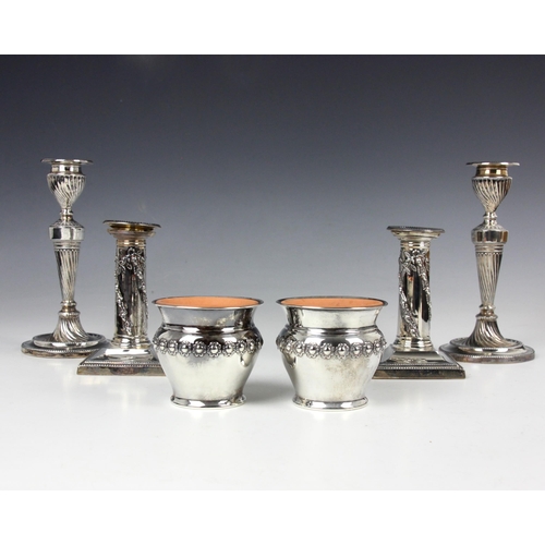 36 - A pair of Edwardian silver mounted candlesticks, Hawksworth Eyre and Co Ltd, Sheffield 1904, the rem... 