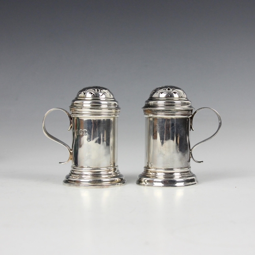 37 - A cased pair of Edwardian Britannia standard silver pepperettes, Charles Stuart Harris, London 1903,... 