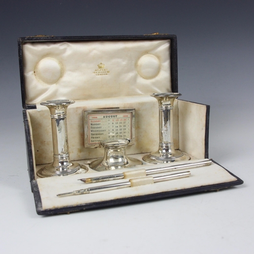 38 - An Edwardian silver mounted travelling desk set, Charles and George Asprey, Birmingham 1901/1905, co... 