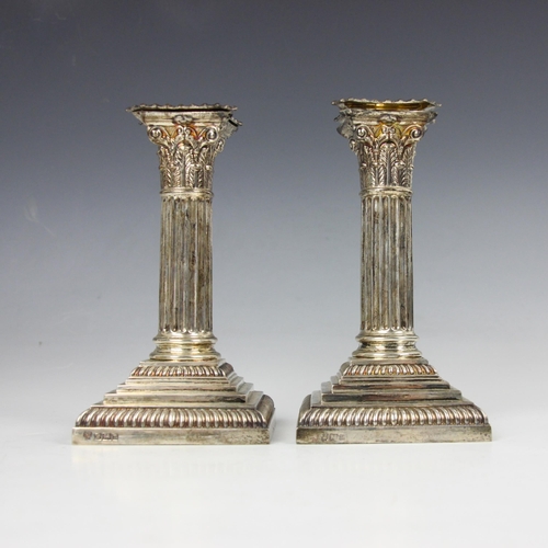 41 - A pair of Edwardian silver candlesticks, Hawksworth Eyre and Co Ltd, Sheffield 1905, the removable d... 