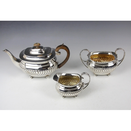 9 - A Victorian near matched three piece silver tea service, Edward Barnard & Sons Ltd, London 1894-1896... 