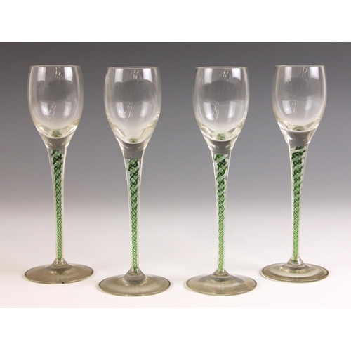 530 - Four wine or cordial glasses, each with ogee bowl above a green and white double series opaque twist... 