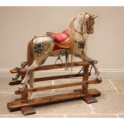A late 19th century dappled dun rocking horse, retailed by Hamleys ...