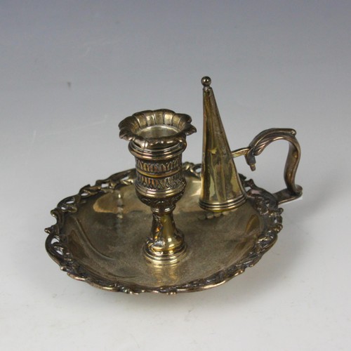 4 - A 19th century white metal chamberstick, marks rubbed, the removeable florally designed drip pan abo... 