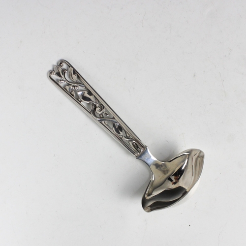 13 - An early 20th century white metal sauce ladle, Johannes Siggaard, the openwork foliate Art Nouveau s... 