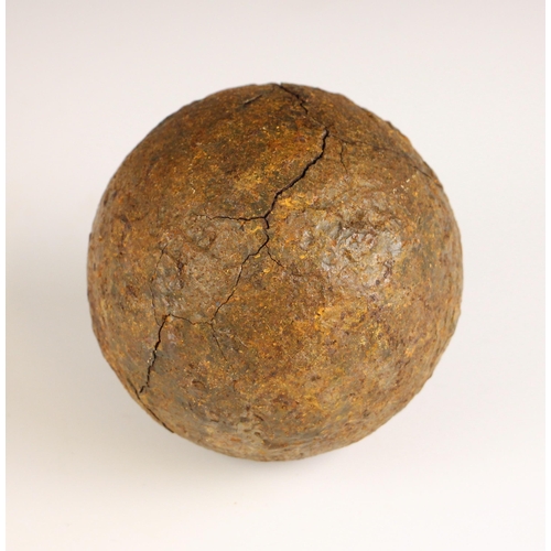 392 - An English Civil War canon ball, mid 17th century, of typical form, 10cm diameter