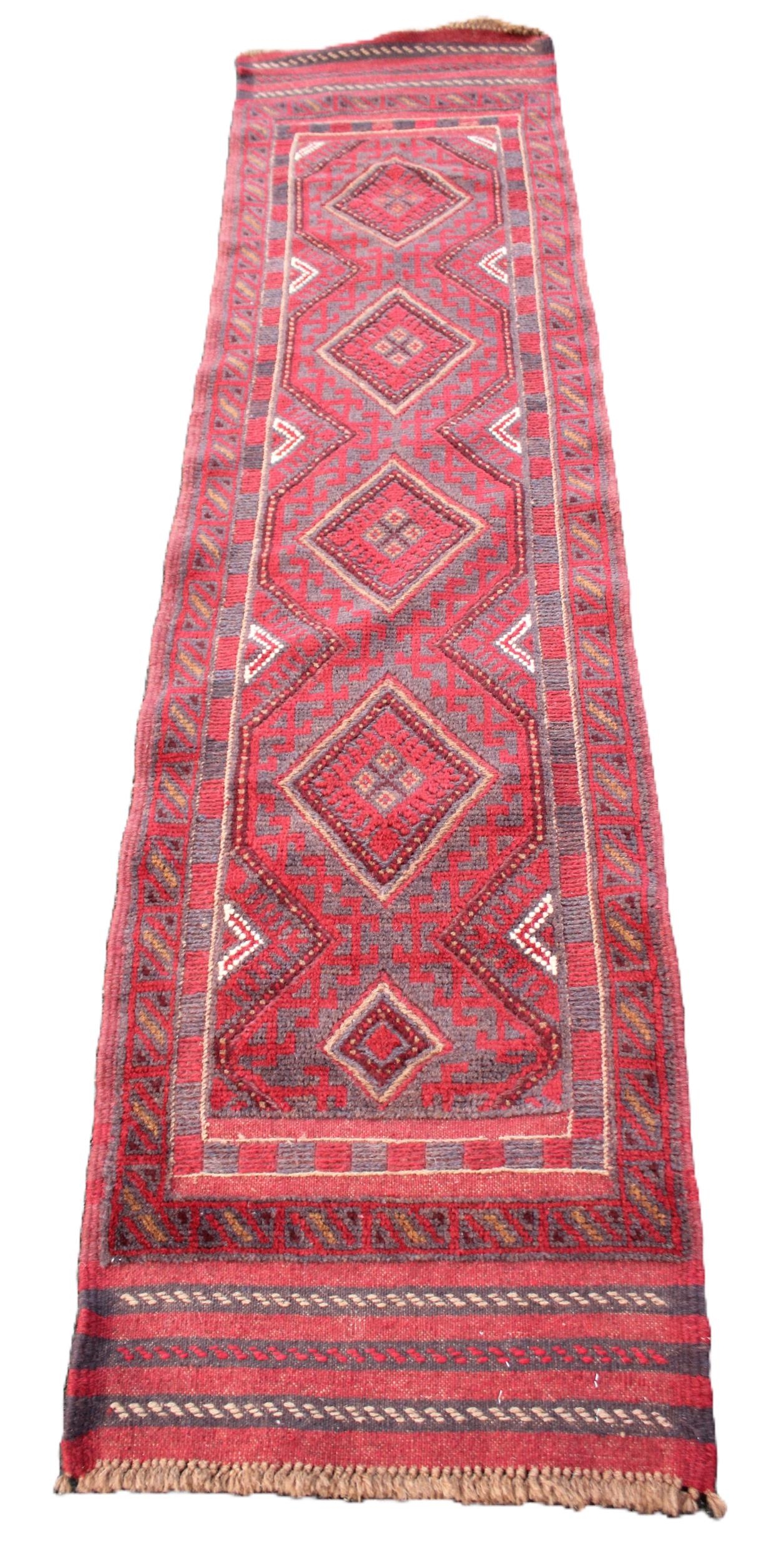 A hand woven Afghan Meshkin tribal runner, in red and blue colourways ...