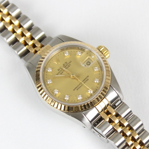 149 - A ladies bi-metal Rolex oyster perpetual datejust wristwatch, the circular champagne dial set with t... 