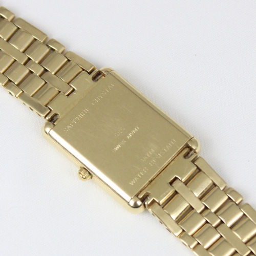 150 - A yellow metal Geneve quartz ladies wristwatch, the rectangular white dial with roman numerals, set ... 