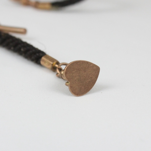 162 - A 19th century woven 'hair' watch chain, suspending T-bar and heart shaped yellow metal fob, with ye... 