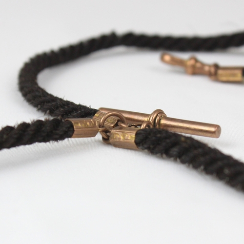 162 - A 19th century woven 'hair' watch chain, suspending T-bar and heart shaped yellow metal fob, with ye... 