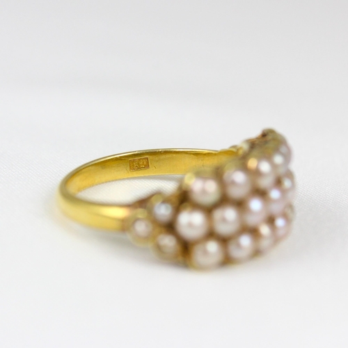 365 - A late 19th/early 20th century 'pearl' ring, the triple row of split pearls, with smaller triple spl... 