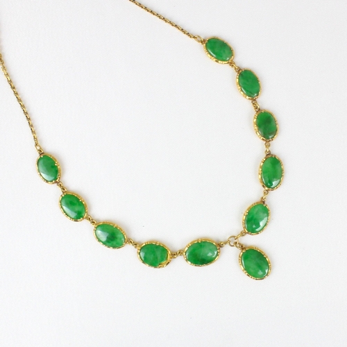 371 - A Chinese yellow metal 'jade' necklace, composed of ten graduated oval panels, suspending further ov... 