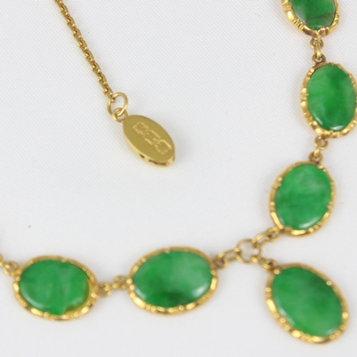 371 - A Chinese yellow metal 'jade' necklace, composed of ten graduated oval panels, suspending further ov... 