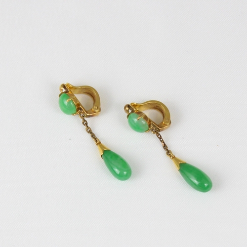 374 - A pair of yellow metal 'jade' drop earrings, the circular cabochon suspending trace link chain and t... 