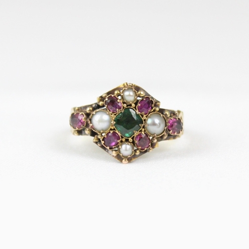 379 - An early 20th century 18ct gold ruby, emerald and 'pearl' ring, the central emerald surrounded by ru... 