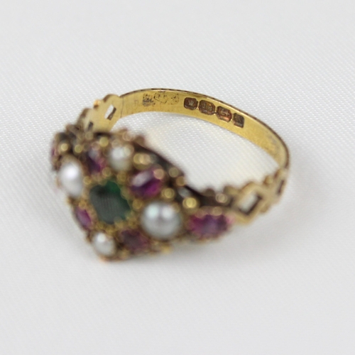 379 - An early 20th century 18ct gold ruby, emerald and 'pearl' ring, the central emerald surrounded by ru... 