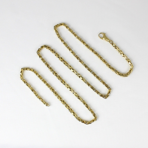 382 - A yellow metal chain, the fancy box link chain with lobster fastener stamped '375' 63cm long, 27.8gm... 