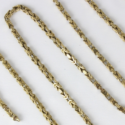 382 - A yellow metal chain, the fancy box link chain with lobster fastener stamped '375' 63cm long, 27.8gm... 